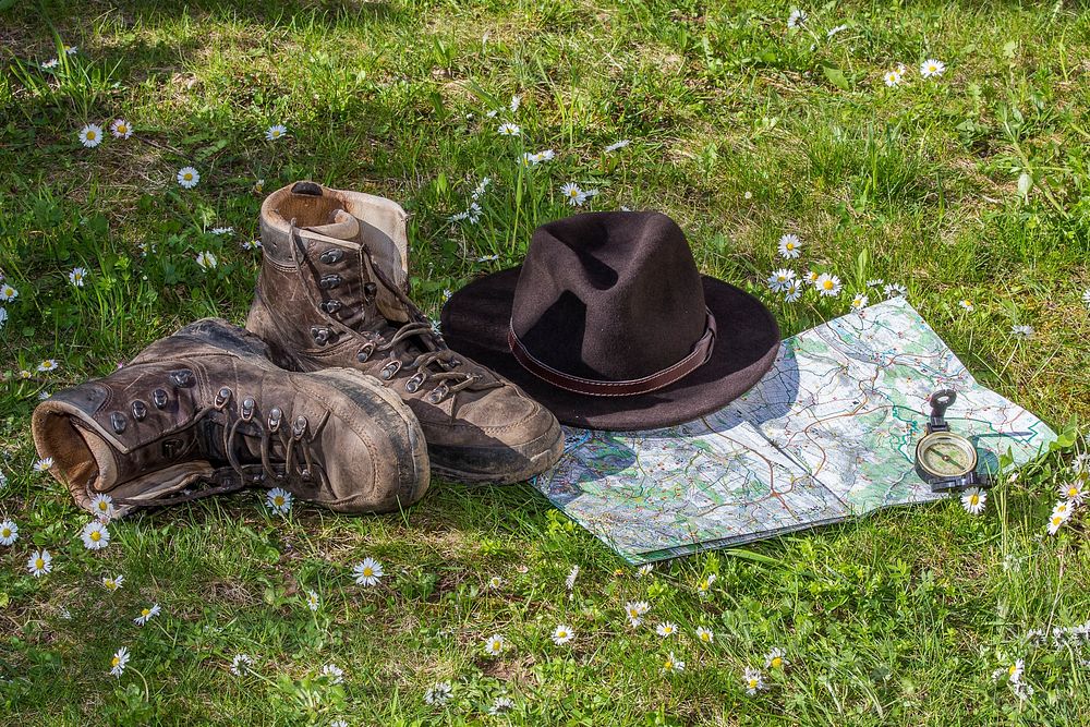 Hat and boots in the grass, free public domain CC0 image.
