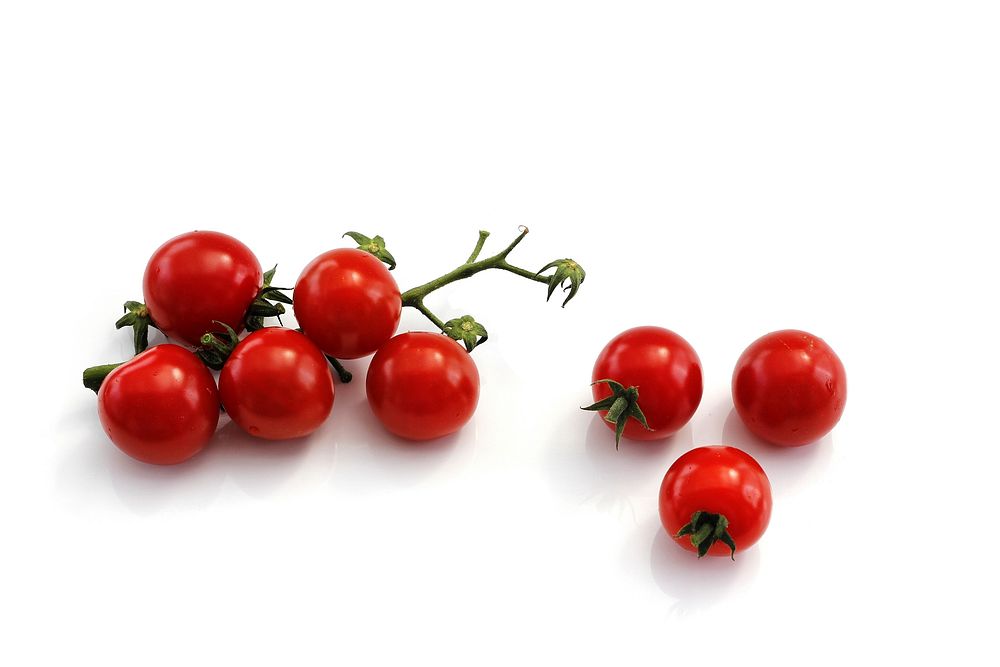 Free cherry tomatoes with stem on white background image, public domain CC0 photo.