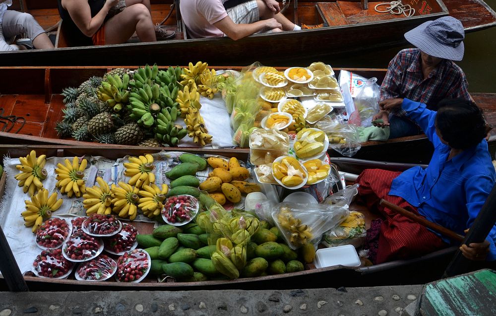 Free fruit boat on floating market seller public domain CC0 photo.