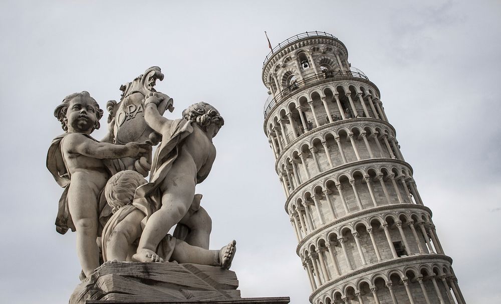 Free Leaning Tower of Pisa and The Fallen Angel statue photo, public domain building CC0 image.