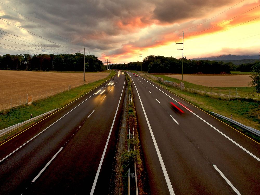 Highway, freeway road in sunset photo, free public domain CC0 image.