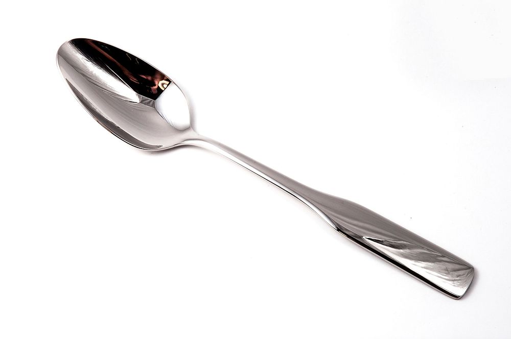 Metal spoon on white background photo, free public domain CC0 photo.