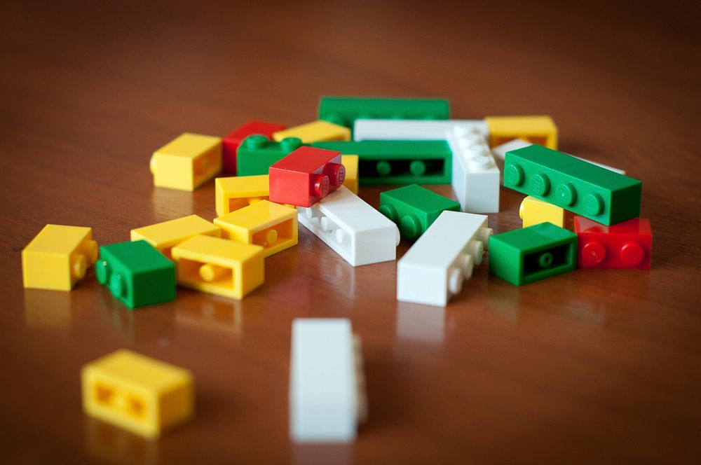 Lego toy on wooden table photo, free public domain CC0 photo.