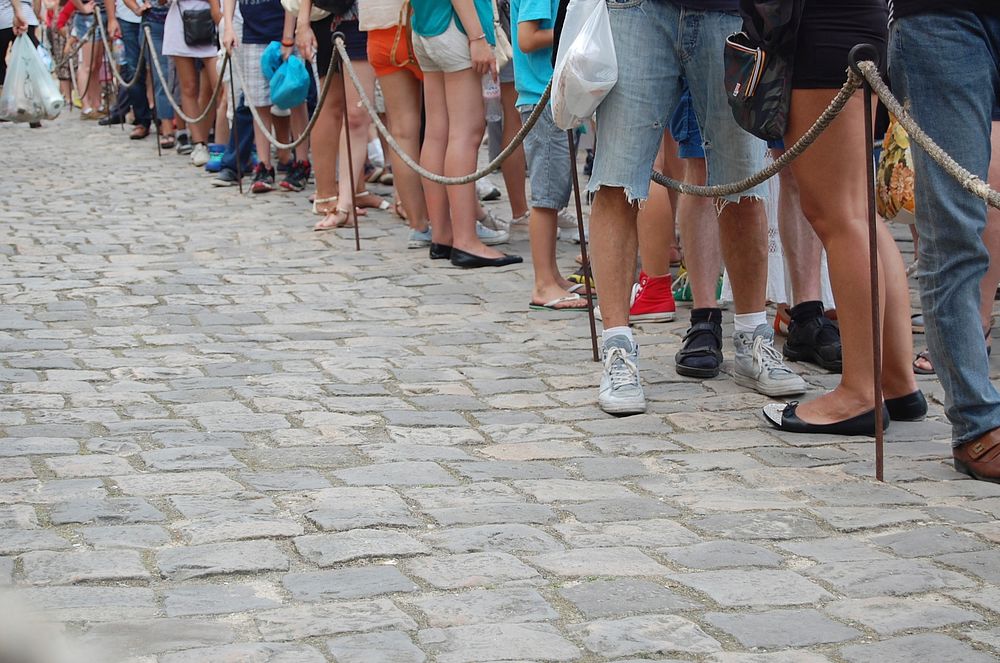 People waiting in line to enter a place. Free public domain CC0 photo.
