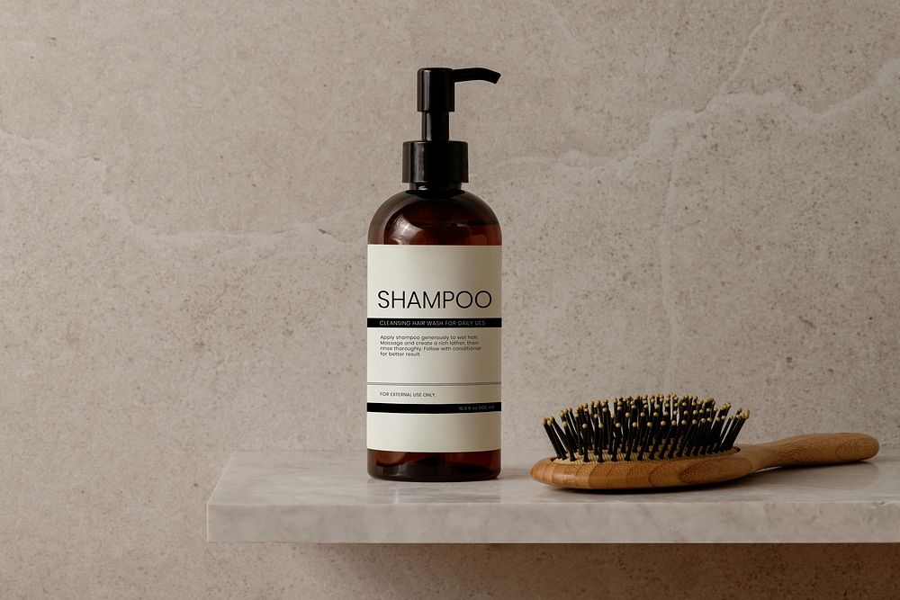 Shampoo dispenser bottle, brown product packaging, with hair brush