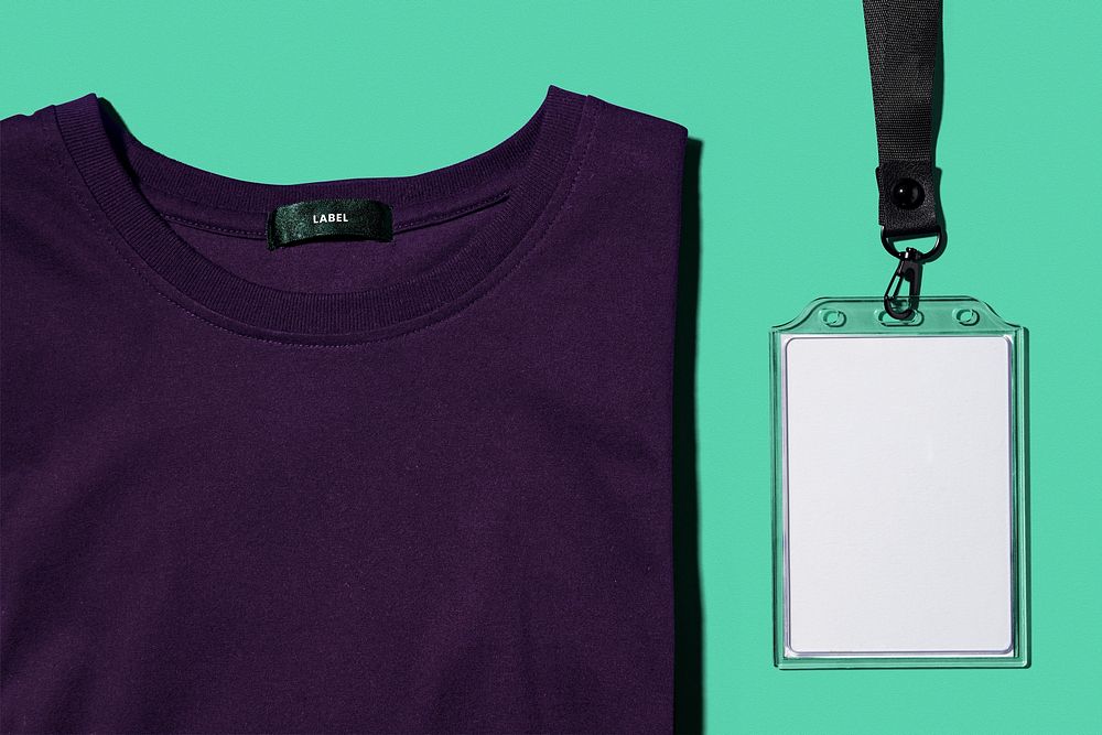 Dark purple t-shirt, next to white ID holder, corporate identity design