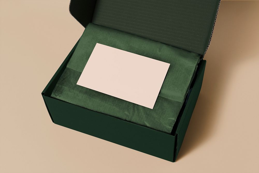 Blank gift card in green parcel box