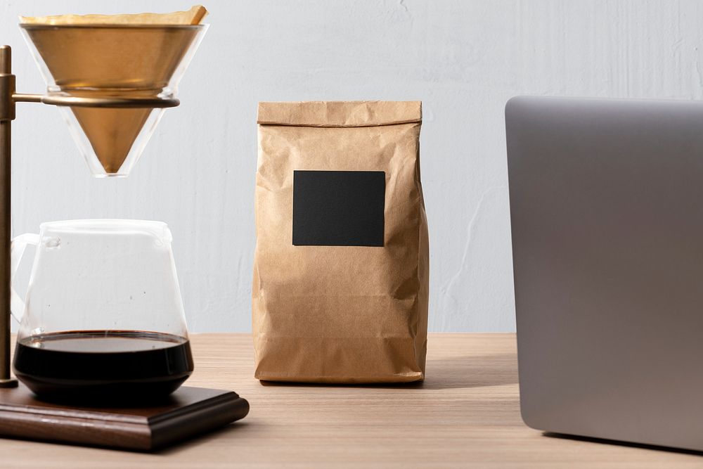 Coffee lover workspace, pour over coffee maker by a laptop