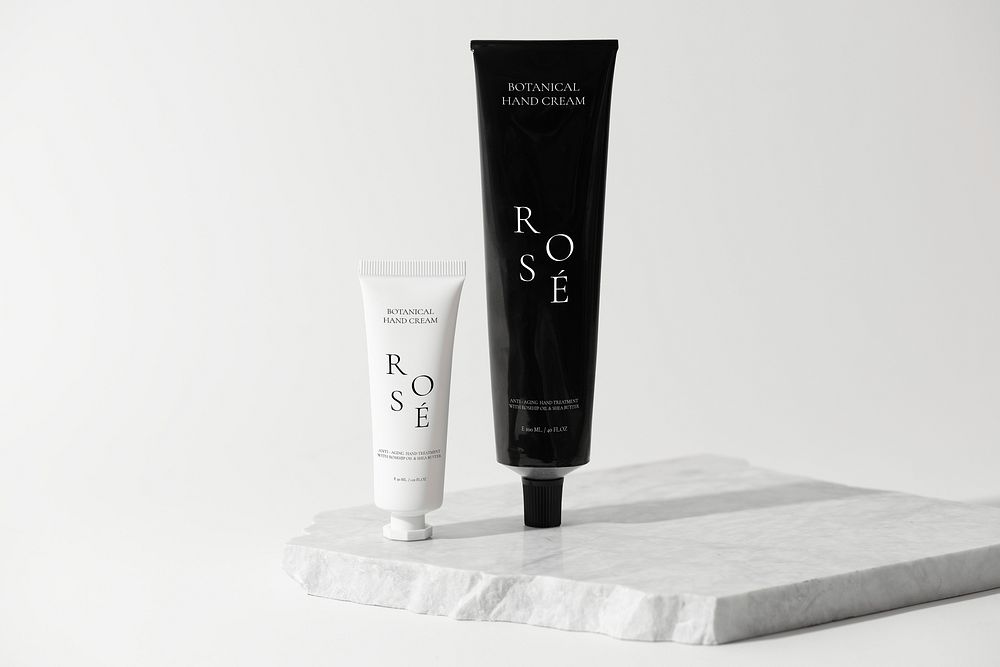 Botanical hand cream, minimal skincare tube, on marble product stand