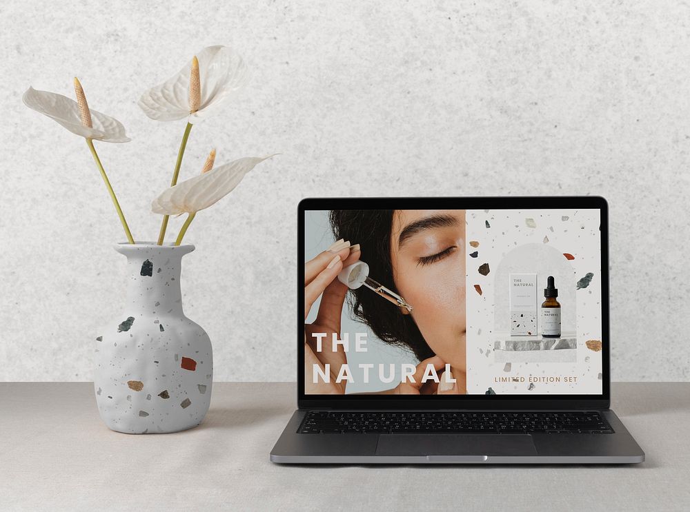 Beauty sale advertisement on a laptop screen, modern home interior
