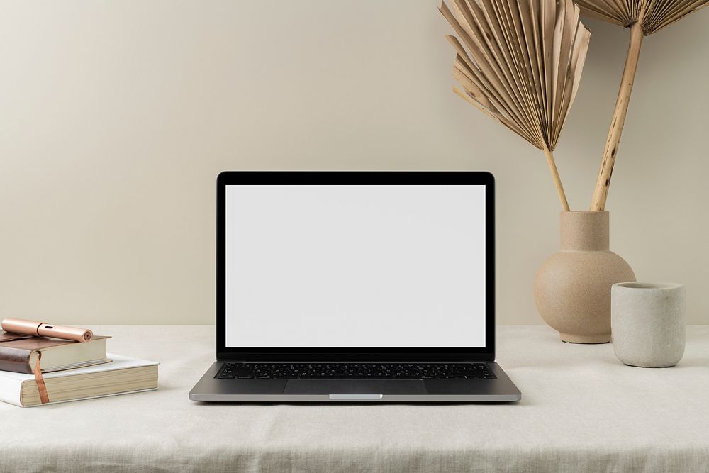 Empty computer laptop screen, modern home interior, cup of coffee