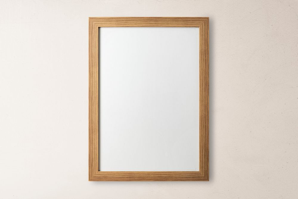 Blank wooden frame, beige wall
