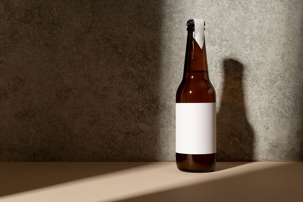 Brown glass bottle with blank label, product branding design