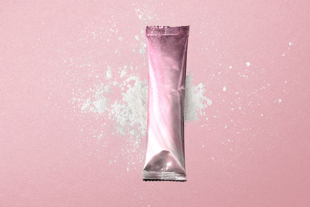 Blank pink stick sachet, beige powder, beauty product packaging design