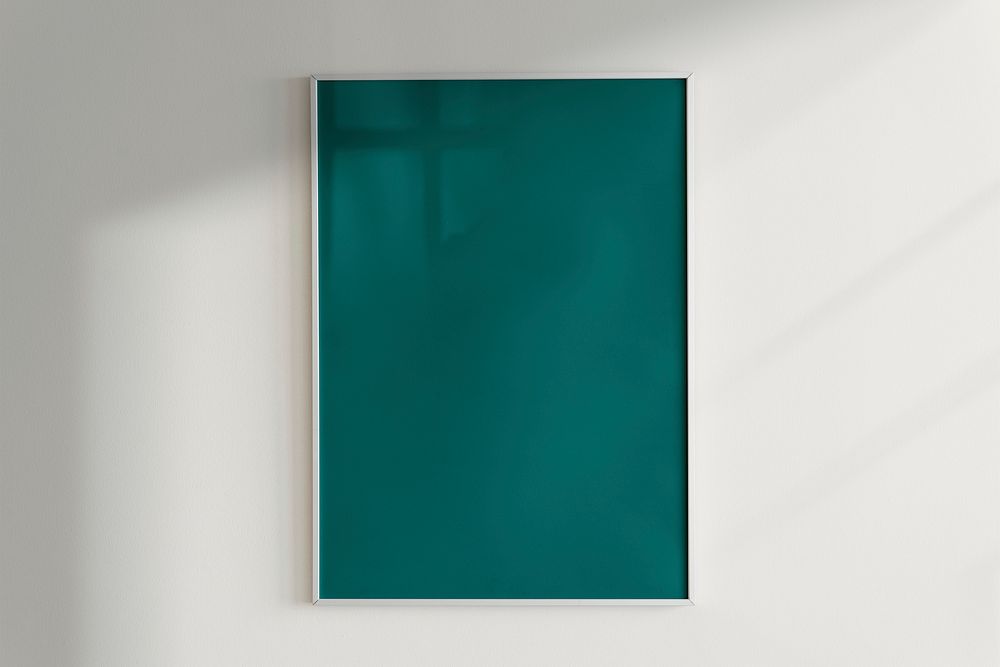 Green frame on a wall with natural light