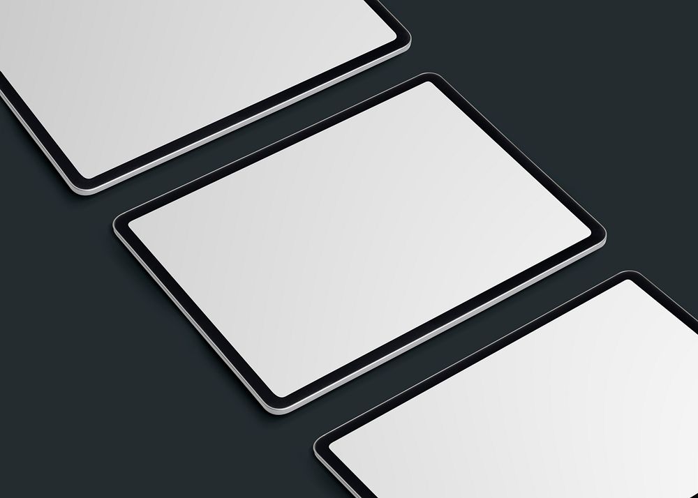 Three blank digital tablets in a row, empty white screens