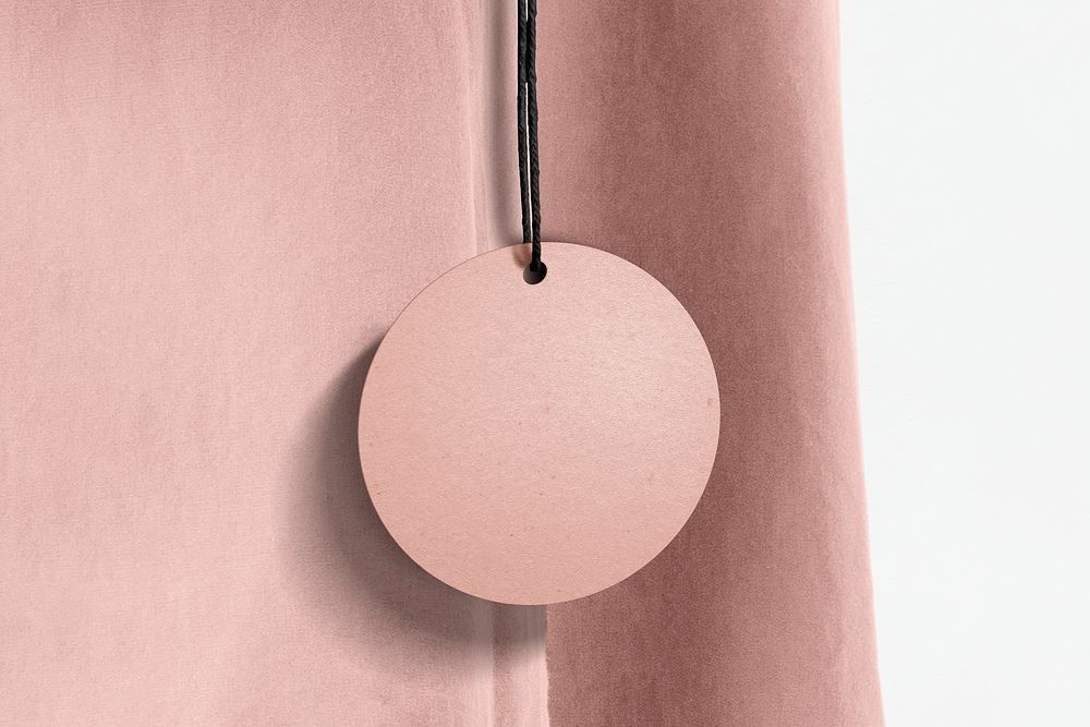Pink clothing tag, apparel branding with blank design space