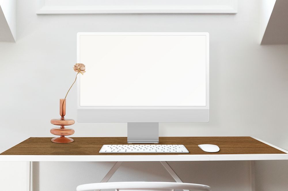 White minimal computer on wooden desk