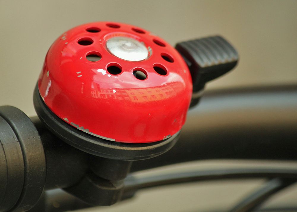 Free red bike bell closeup photo, public domain CC0 image.