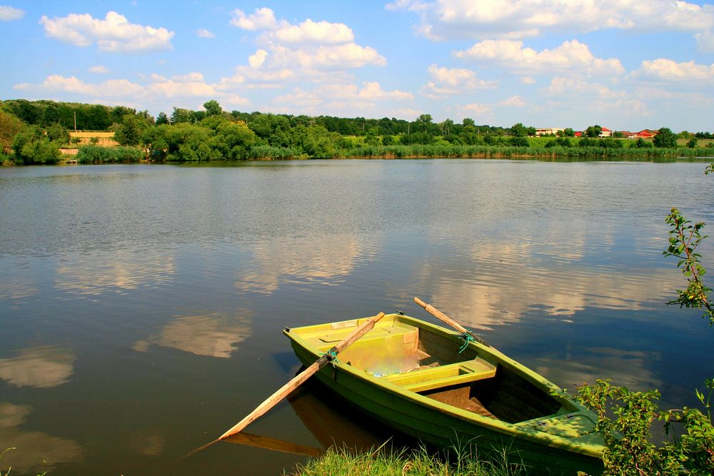Free rowboat on a lake image, public domain CC0 photo.