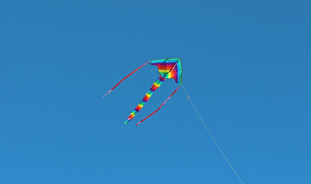 Free kite in blue sky image, public domain childhood CC0 photo.