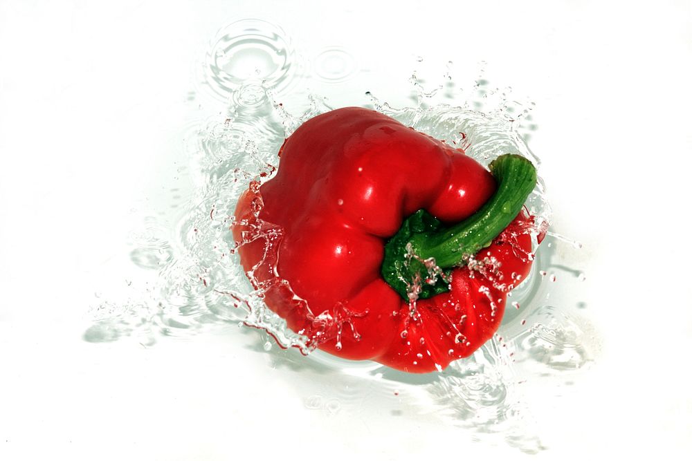 Free red bell pepper, water splash image, public domain vegetables CC0 photo.