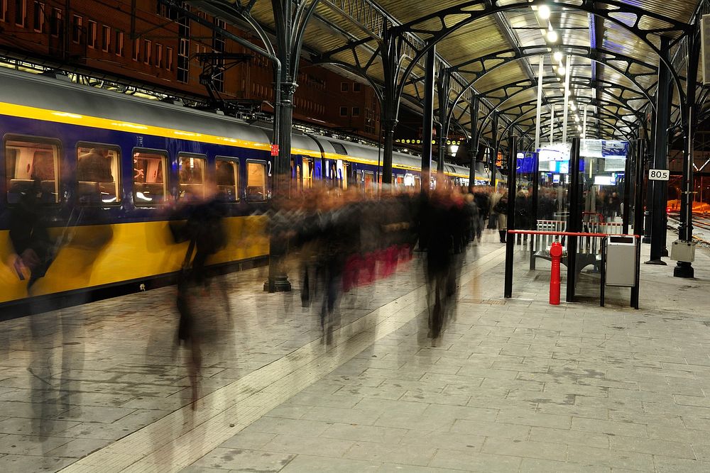 Free train station with people walking motion image, public domain CC0 photo.