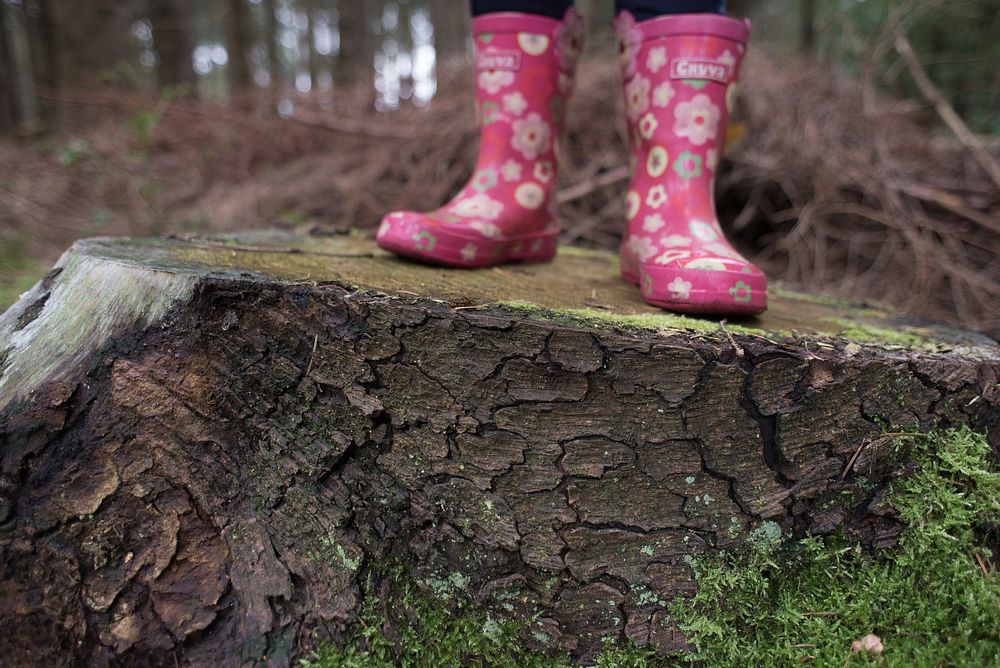 Free kid wearing pink rain boots photo, public domain shoes CC0 image.