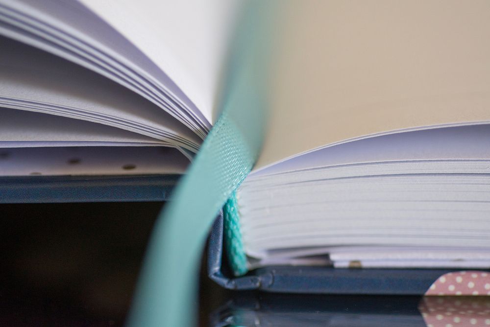 Free open notebook with bookmark strap closeup photo, public domain CC0 image.