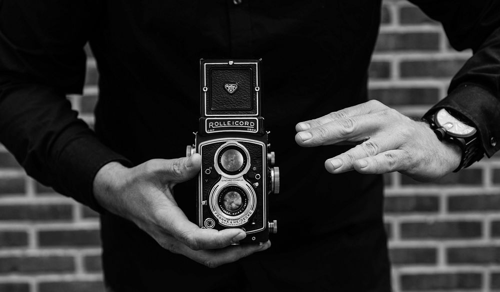Man holding Rolleicord camera, location unknown, 25 September 2017.