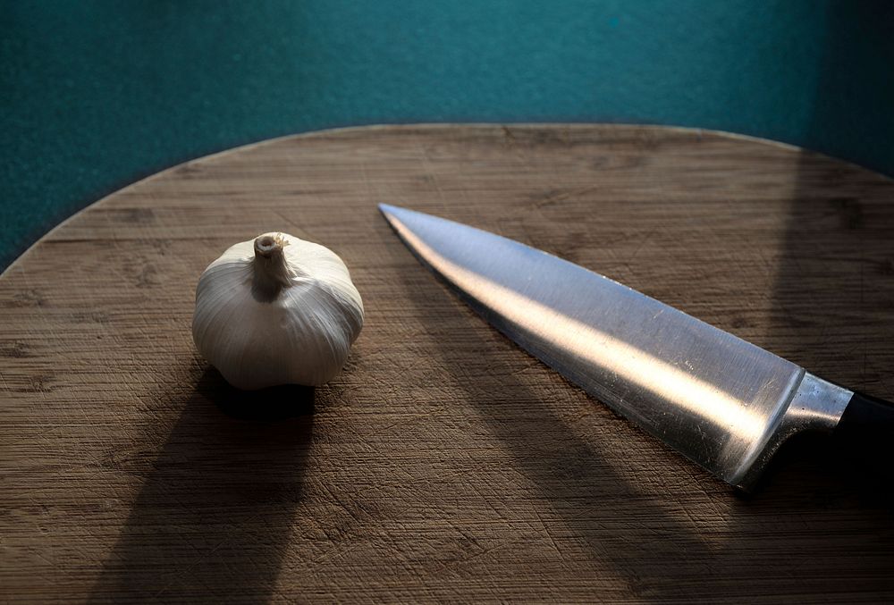 Free knife and garlic closeup photo, public domain food CC0 image.