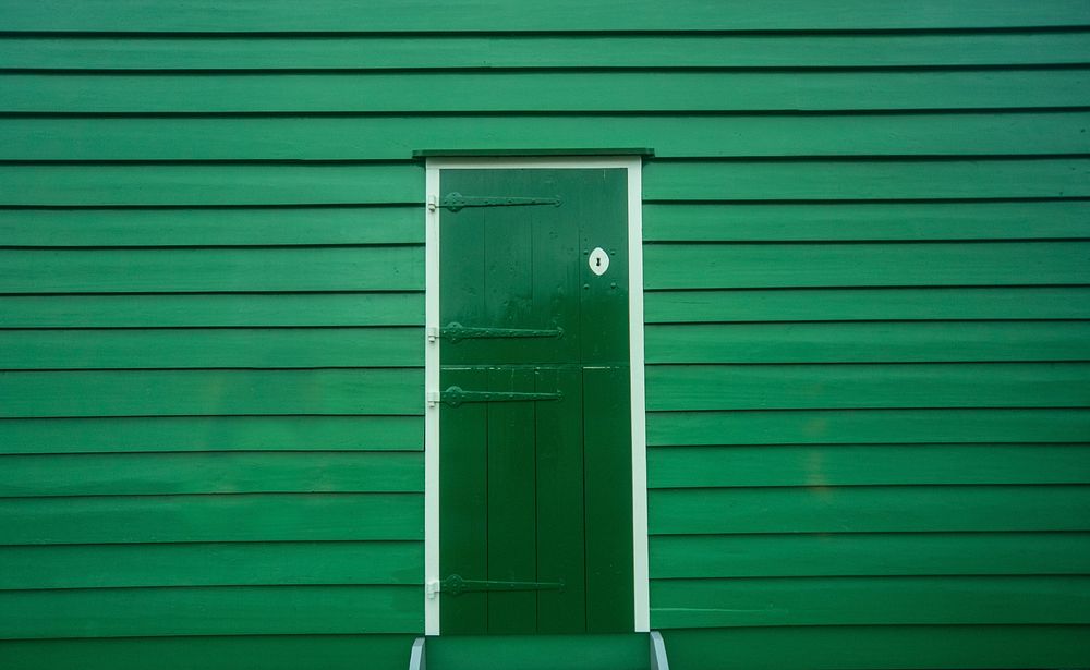 Green door of a wooden house photo, free public domain CC0 image.