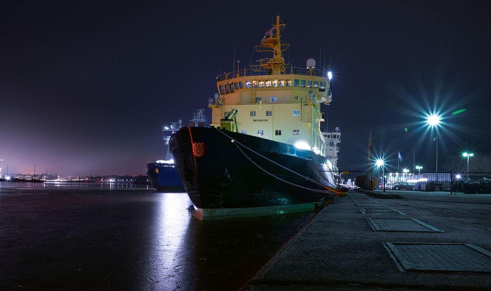 Free ship moored to dock at night image, public domain CC0 photo.