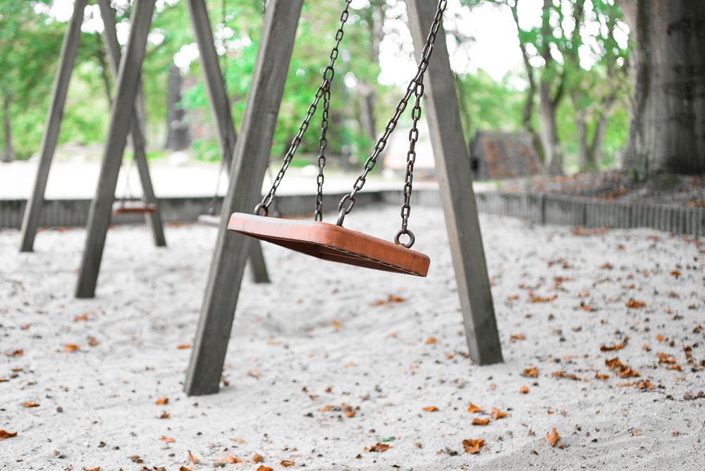 Swing in playground. Free public domain CC0 image.