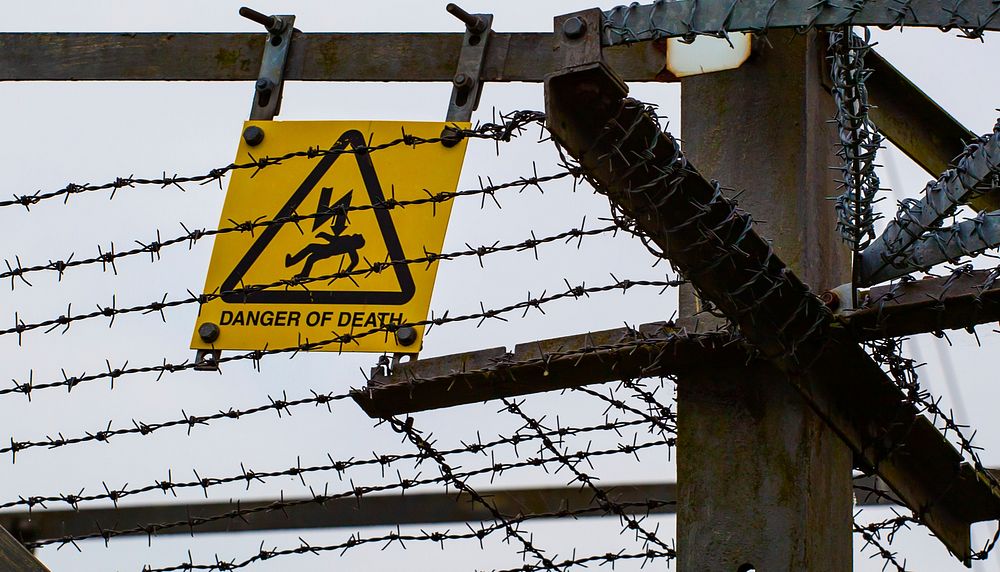 Free danger of death sign behind barbed wire  image, public domain CC0 photo.