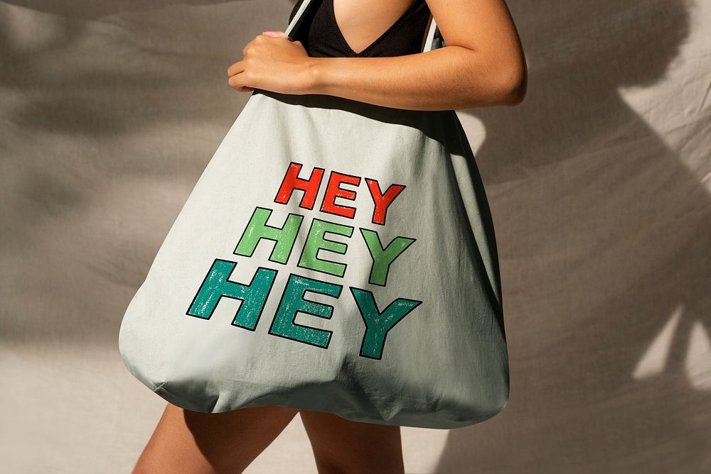 Colorful tote bag with trendy text with female model, cute and stylish design