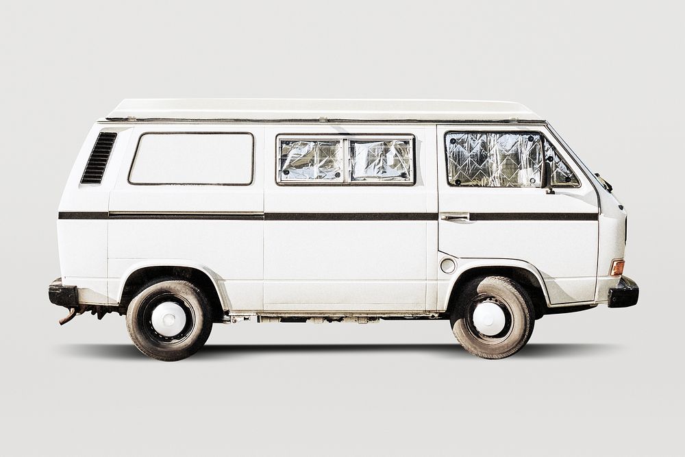 Old white campervan with blocked out windows