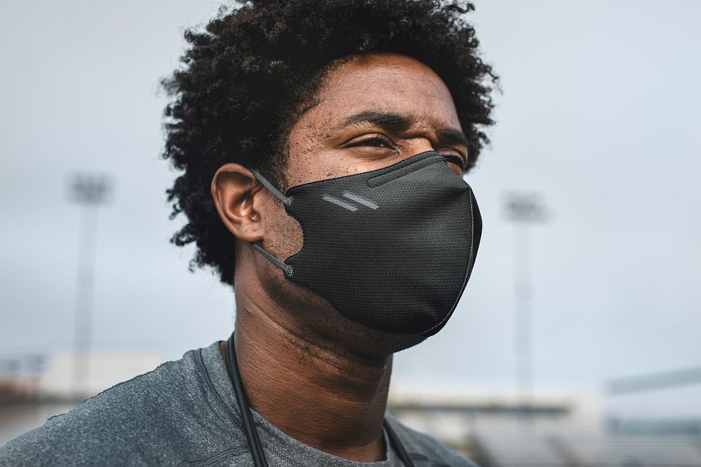 Male athlete wearing mask in the new normal 