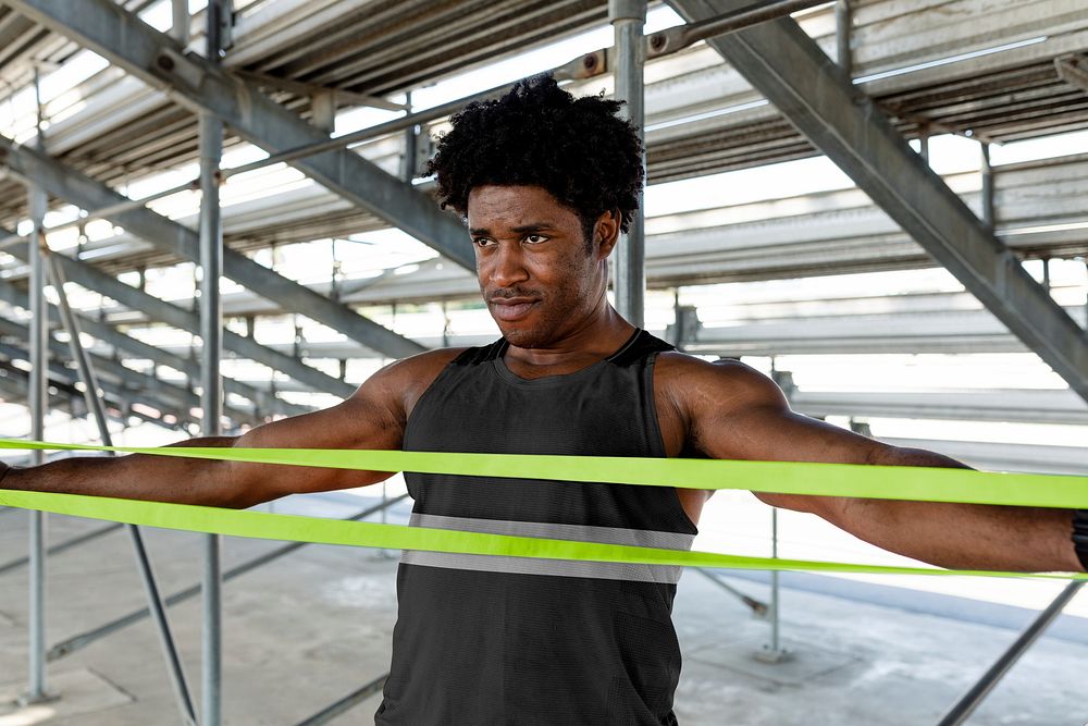 Male athlete using a resistance band