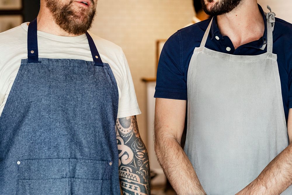 Cool small business owners in aprons