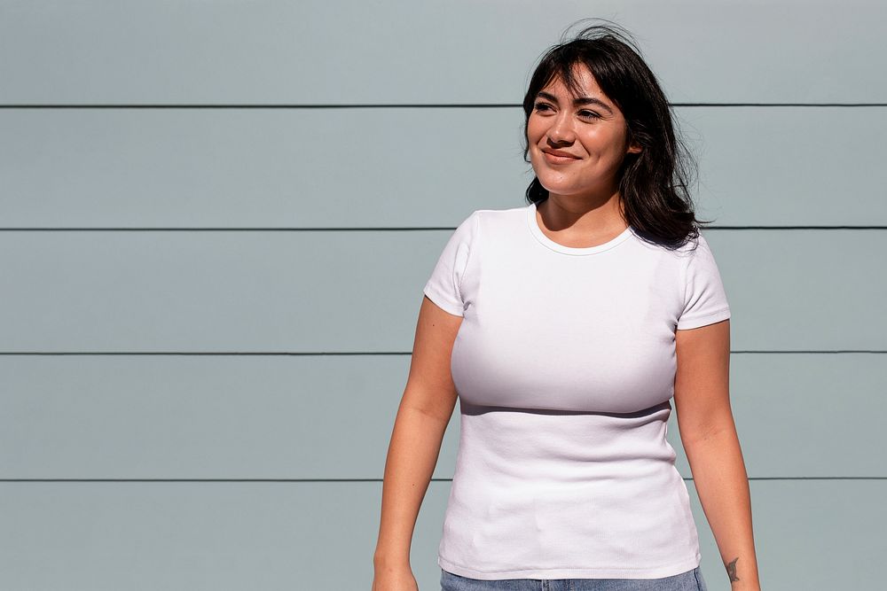 Woman wearing a casual outfit, plain white shirt 