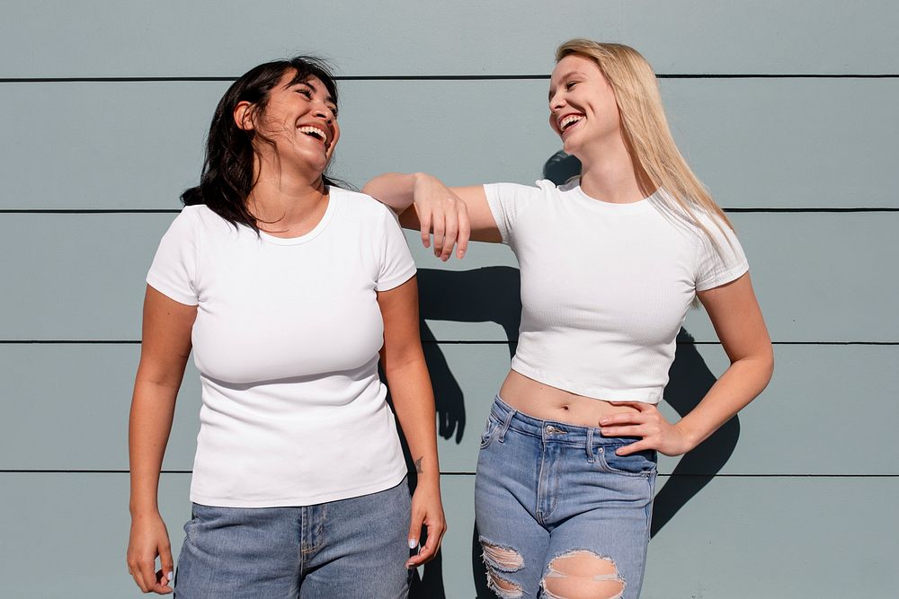 Women wearing plain white shirt, mixed race friends