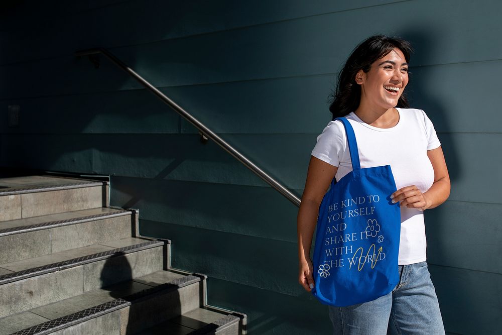 Confident Latina woman with a tote bag, be kind to yourself and share it with the world