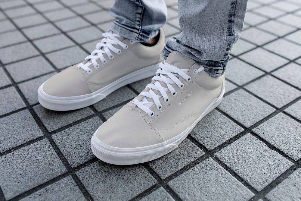 Plain sneaker, men's footwear on a grey tiled floor