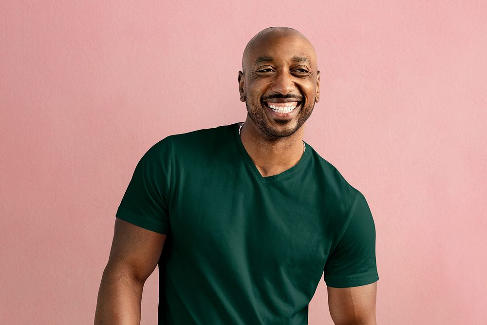 Happy man wearing a basic green tshirt