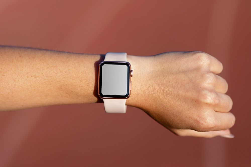 Hand wearing a smartwatch, blank touchscreen