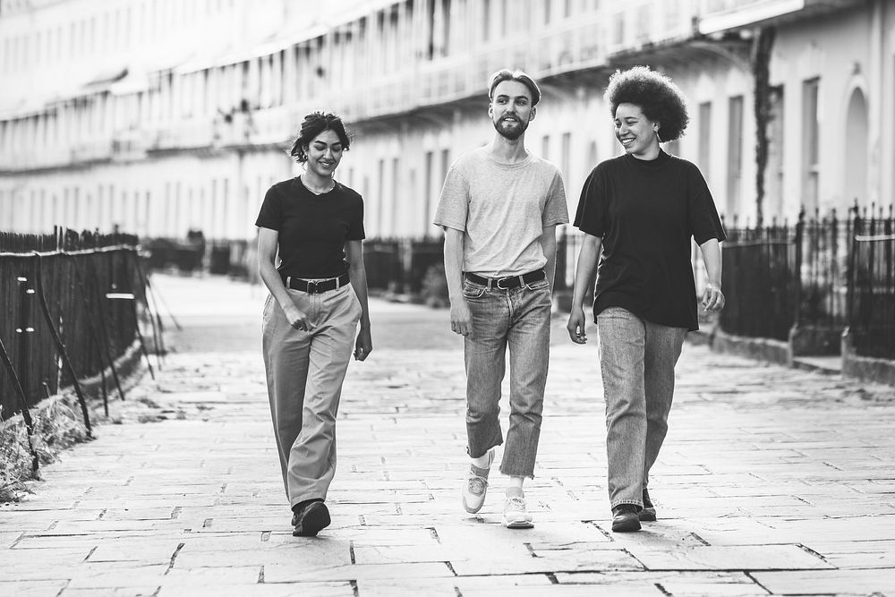 Three friends strolling in the city 