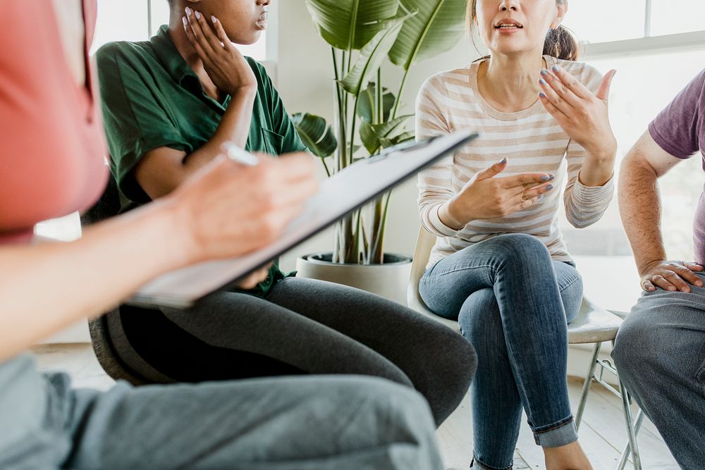 Diverse people in a supporting group session