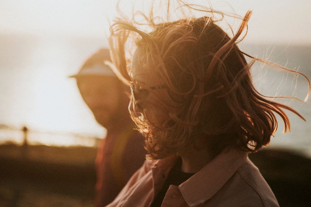 Woman strolling around with her friend in harsh winds