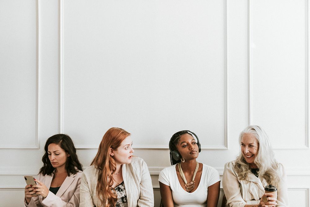 Happy businesswomen using digital devices
